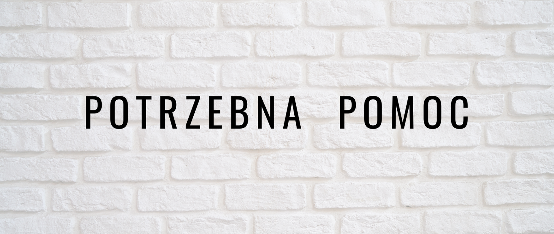 na grafice widać czarne litery na jasnym tle z cegieł