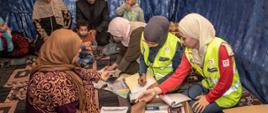 woman during medical visit in refugee camp in Jordan