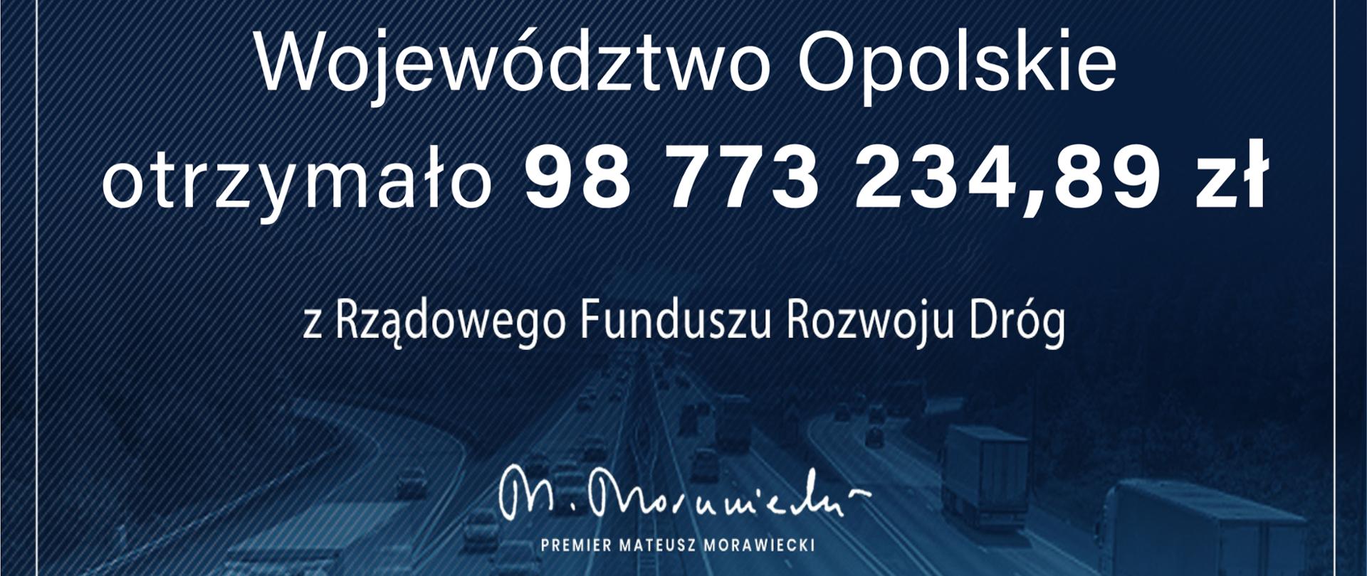 Na czeku widnieje napis "Rządowy Fundusz Rozwoju Dróg. Województwo Opolskie otrzymało kwotę 98773234 zł i 89 groszy z Rządowego Funduszu Rozwoju Dróg" oraz podpis premiera M. Morawieckiego.