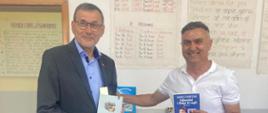 Chargé d'Affaires of Poland Wojciech Unolt and the Head of School during donation.