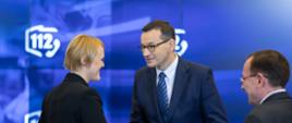 Premier Mateusz Morawiecki oraz minister Mariusz Kamiński podczas Europejskiego Dnia Numeru Alarmowego 112 w MSWiA