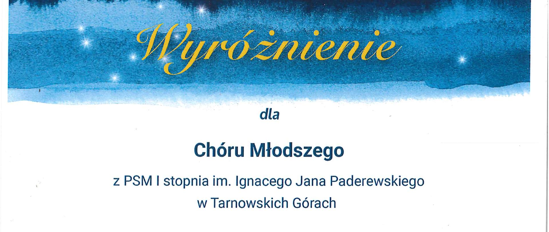 Tło plakatu w większości białe. W górnej części tło niebieskie na którym widniej w kolorze żółtym napis "wyróżnienie". Na środku napis w kolorze niebieskim "dla chóru młodszego z PSM I stopnia im.Ignacego Jana Paderewskiego w tarnowskich Górach w kategorii Chóry w IX Ogólnopolskim Konkursie Kolę i Pastorałek "kolędujemy razem". W dolnej części napis Łódź, 31 stycznia 2023 oraz podpisy komisji