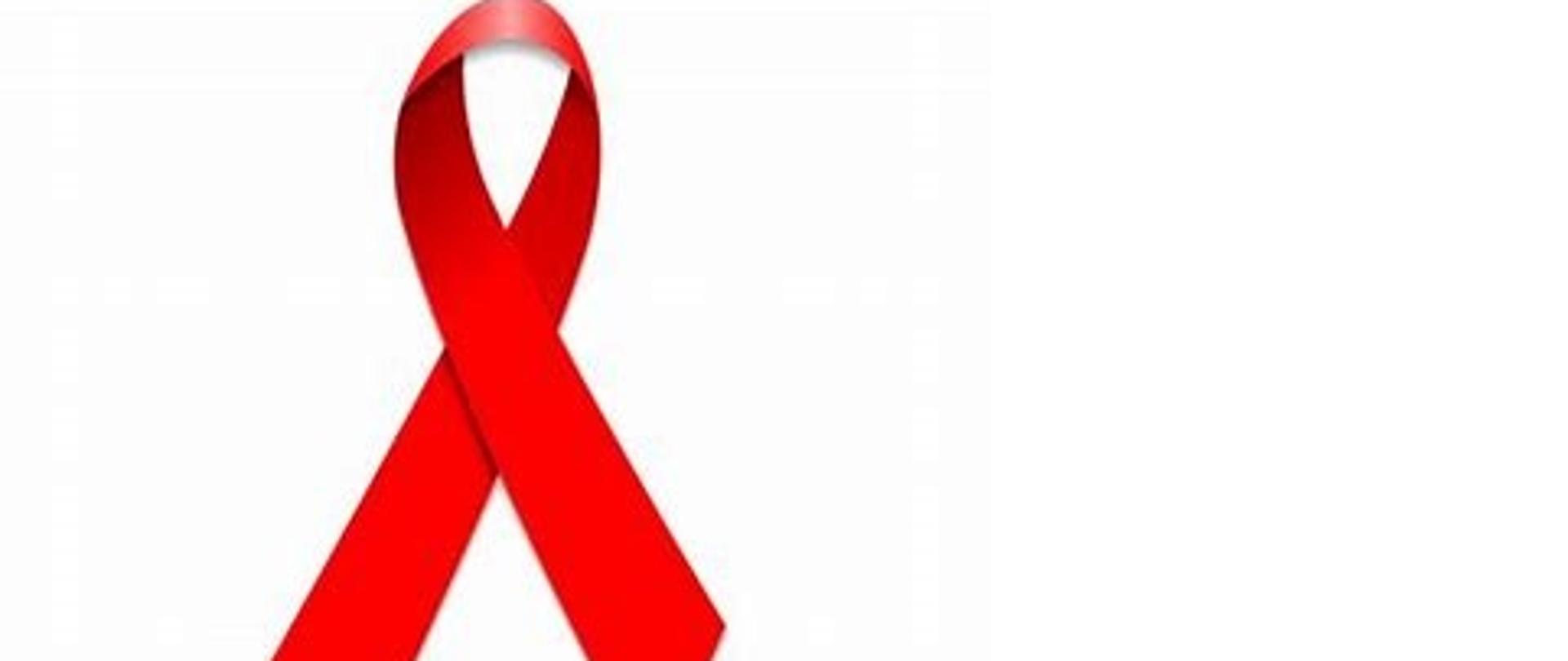 na zdjęciu czerwona kokardka - symbol solidarności z osobami żyjącymi z HIV i AIDS