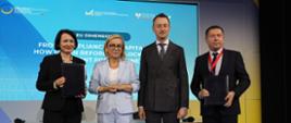 Minister of Climate and Environment Paulina Hennig-Kloska at the international Ukraine Recovery Conference. The photograph shows the Minister standing with three other participants and posing for a group photo.