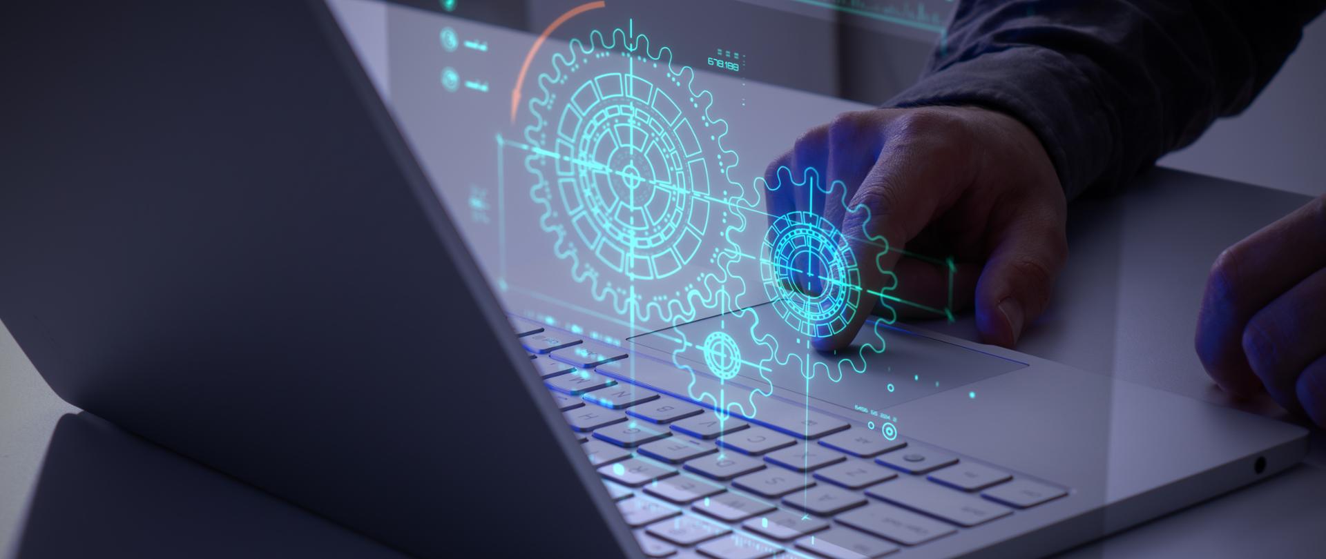 Person using a laptop with a glowing gears icon. Concept of business process workflow optimization and automation, digital transformation, robotic process automation and flowing process management.