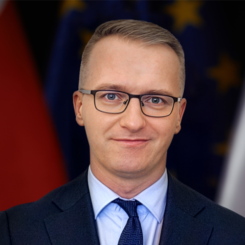 Director General Piotr Kudelski against Polish and EU flags