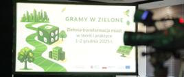 Na zdjęciu grafika przedstawiająca hasło projektu i zabudowę miejską