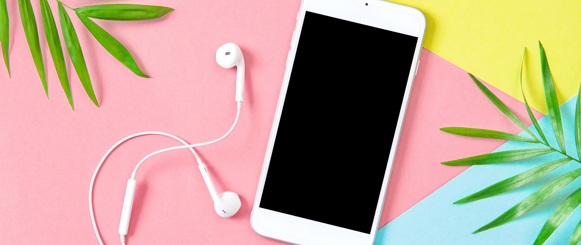 Biały telefon i białe słuchawki na kolorowym tle (przewaga różowego, żółty, niebieski - geometryczne wzory). W rogach - lewym górnym i prawym dolnym, zielone liście 