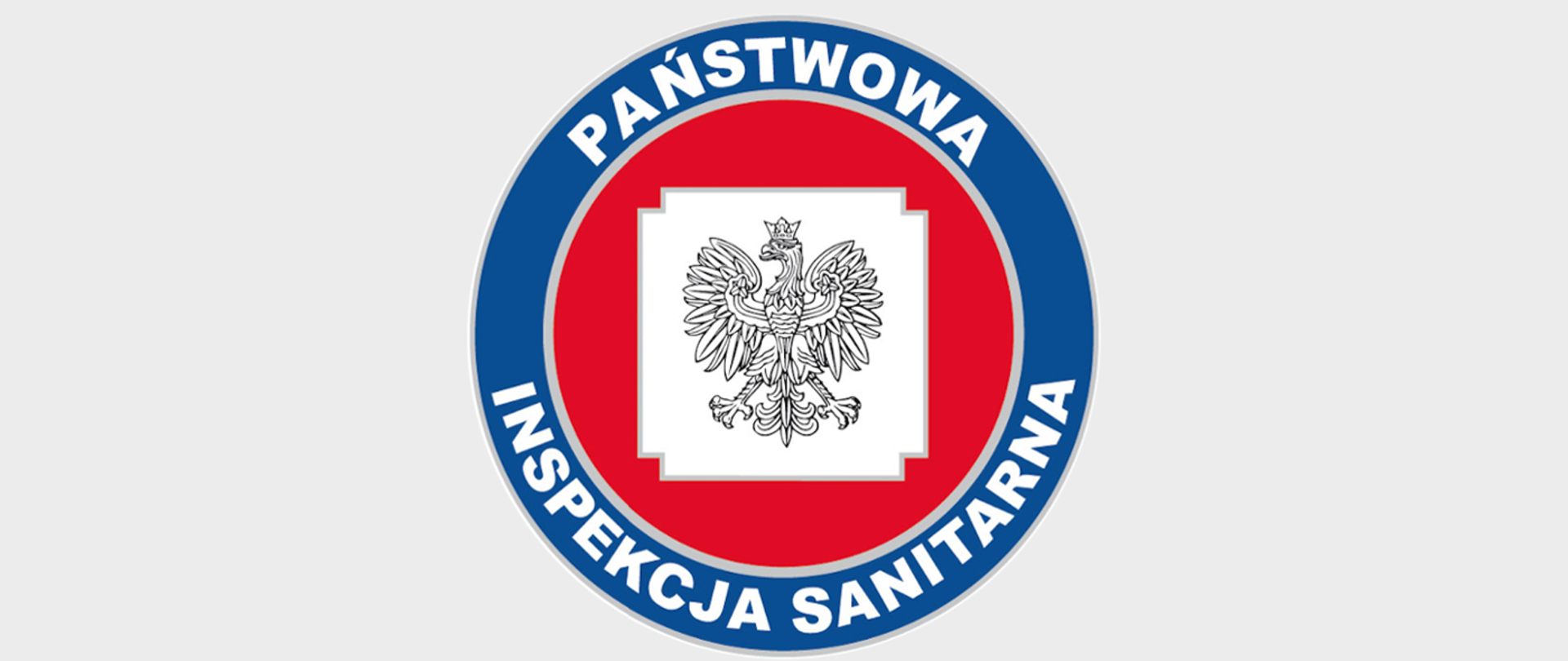Logo Państwowej Inspekcji Sanitarnej - okrąg, orzeł na białym tle na środku koła, dookoła czerwone tło, dookoła niebieski pierścień z białym napisem "Państwowa Inspekcja Sanitarna"