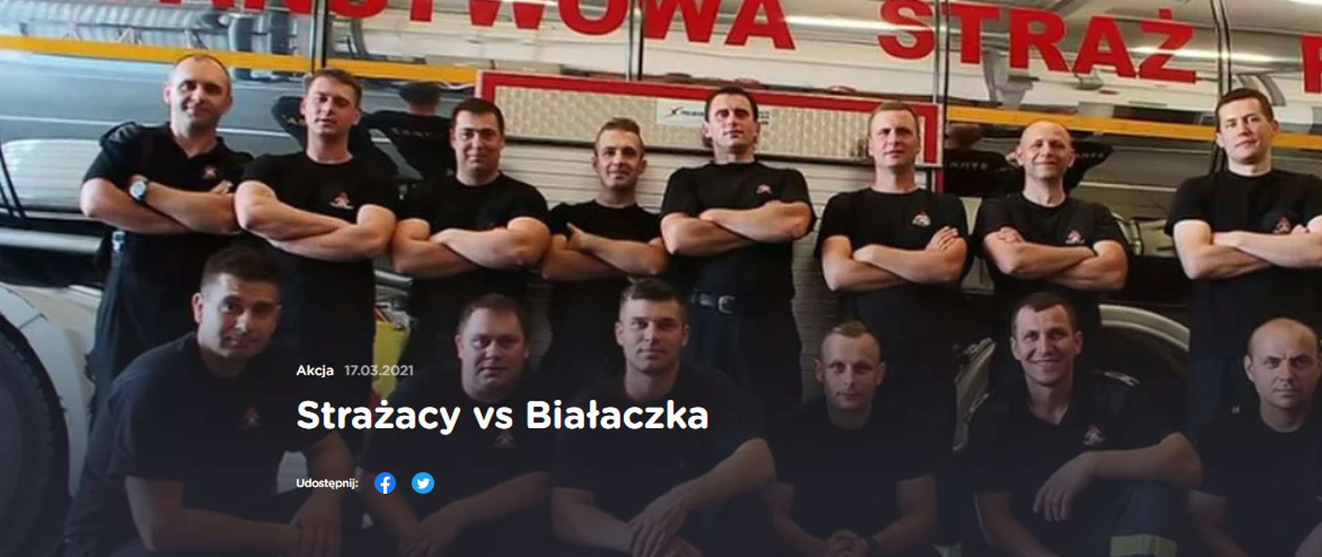 Na zdjęciu widzimy strażaków promujących akcję strażacy kontra białaczna. Zdjęcie wykonane w porze dziennej na garażu.