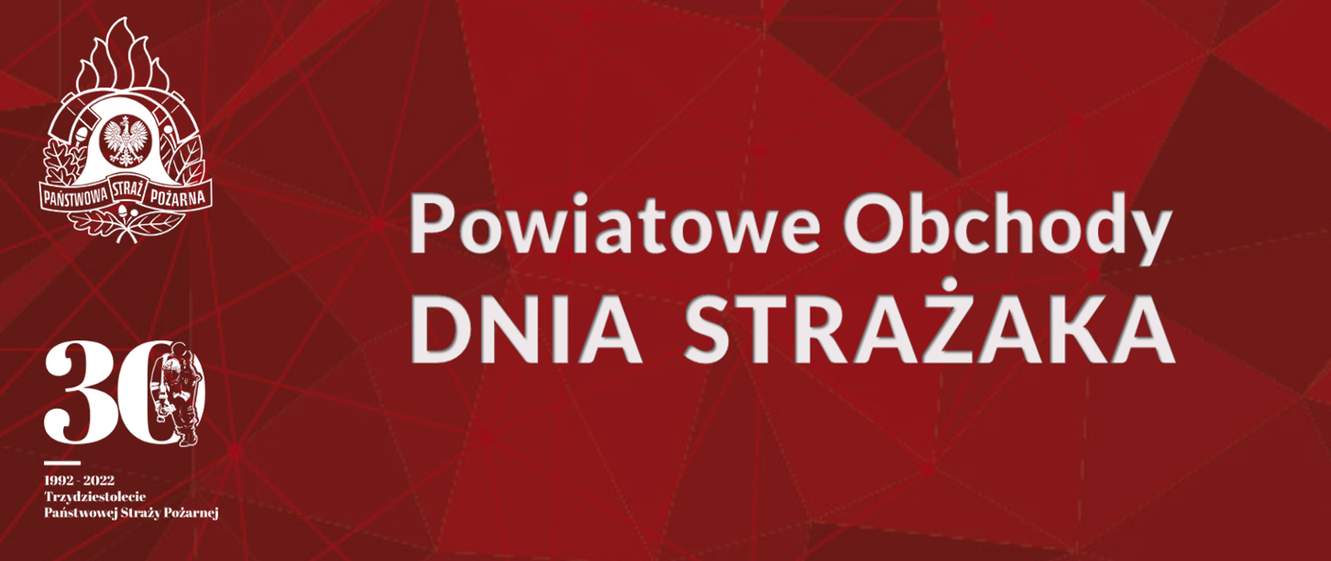 Na czertwonym tle po lewej stronie logo psp w kolorze białym, pod nim logo trzydziestolecia PSP w kolorze białym. Na środku napis "Powiatowe Obchody DNIA STRAŻAKA"