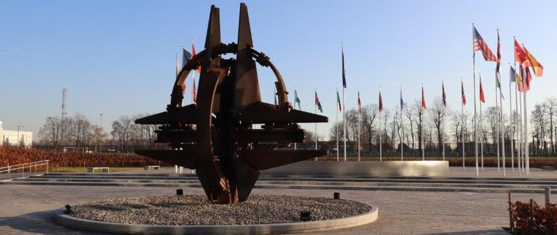 Compass rose and flags in front of NATO HQ