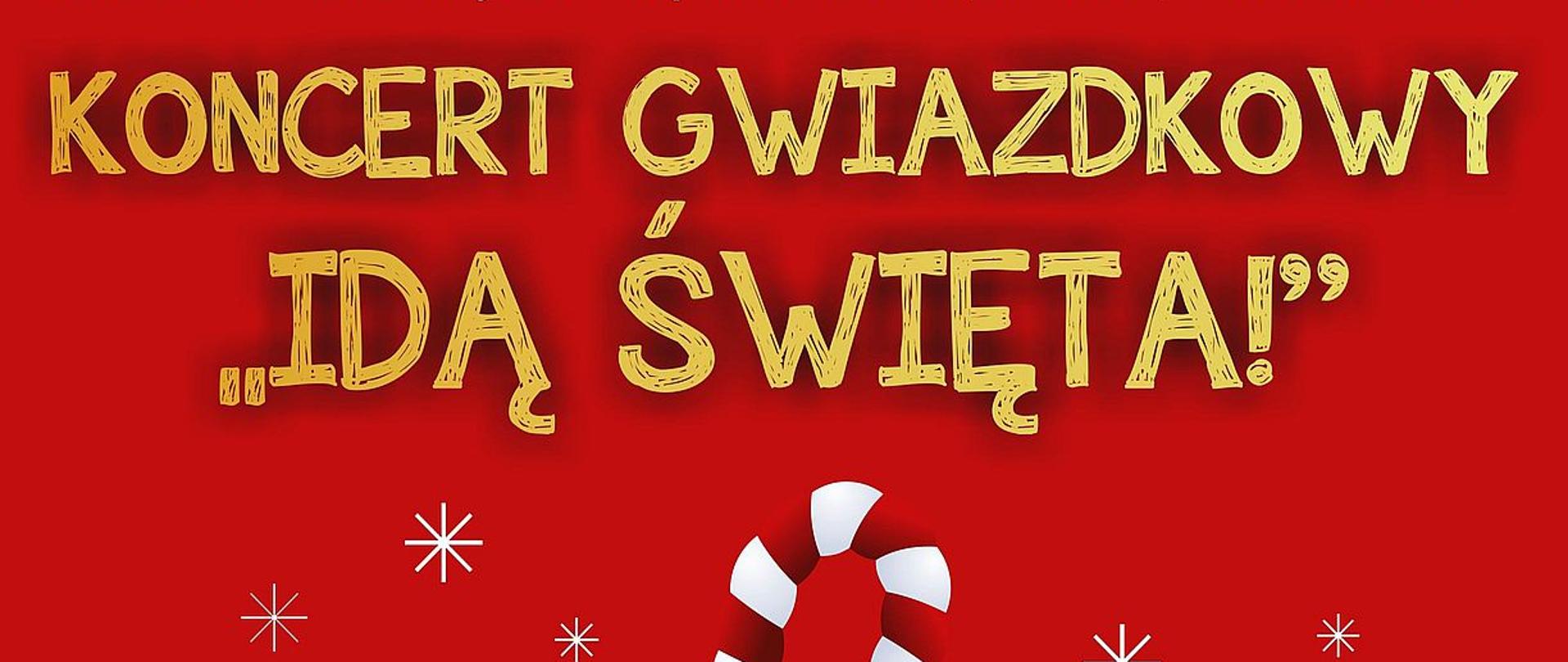 Plakat informujący o koncercie gwiazdkowym "Idą Święta!" w dniu 15 grudnia 2025 roku. Białe i złote litery na czerwonym tle. W centralnym punkcie plakatu klucz wiolinowy wykonany z biało-czerwonego cukierka.