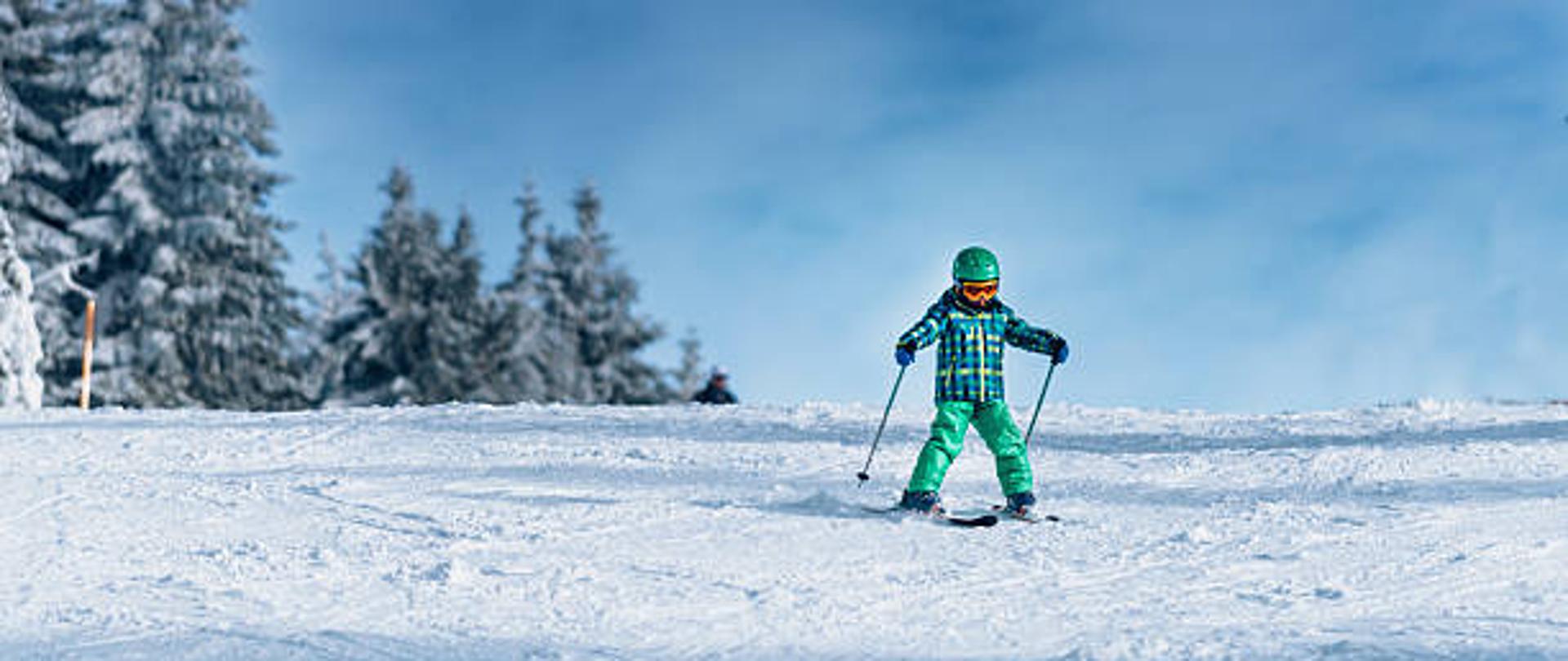 Little boy skiing on a mountain