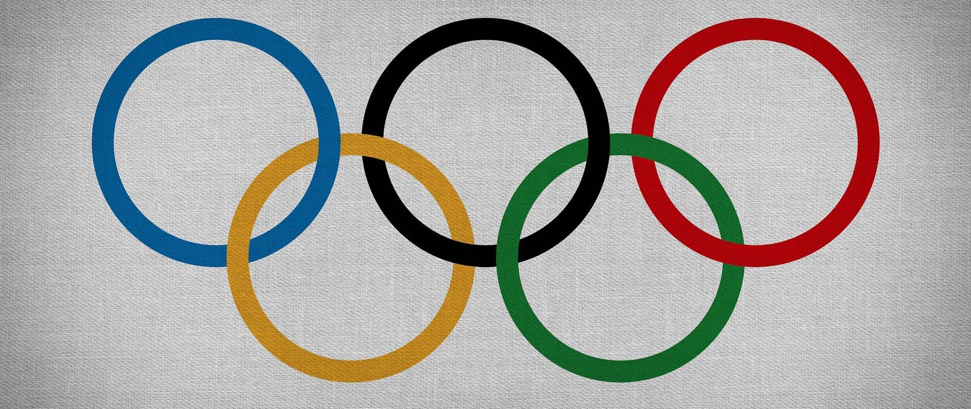 Symbole olimpiady - przeplatające się kolorowe koła.
