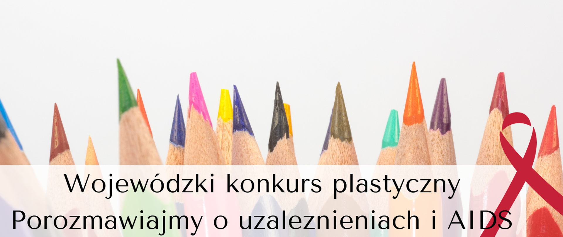Zdjęcie przedstawia kolorowe kredki na białym tle oraz tekst Wojewódzki konkurs plastyczny Porozmawiajmy o uzależnieniach i AIDS