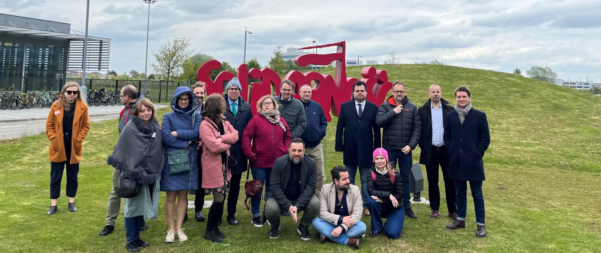 A group of journalists standing in front of the Soldiarity logo
