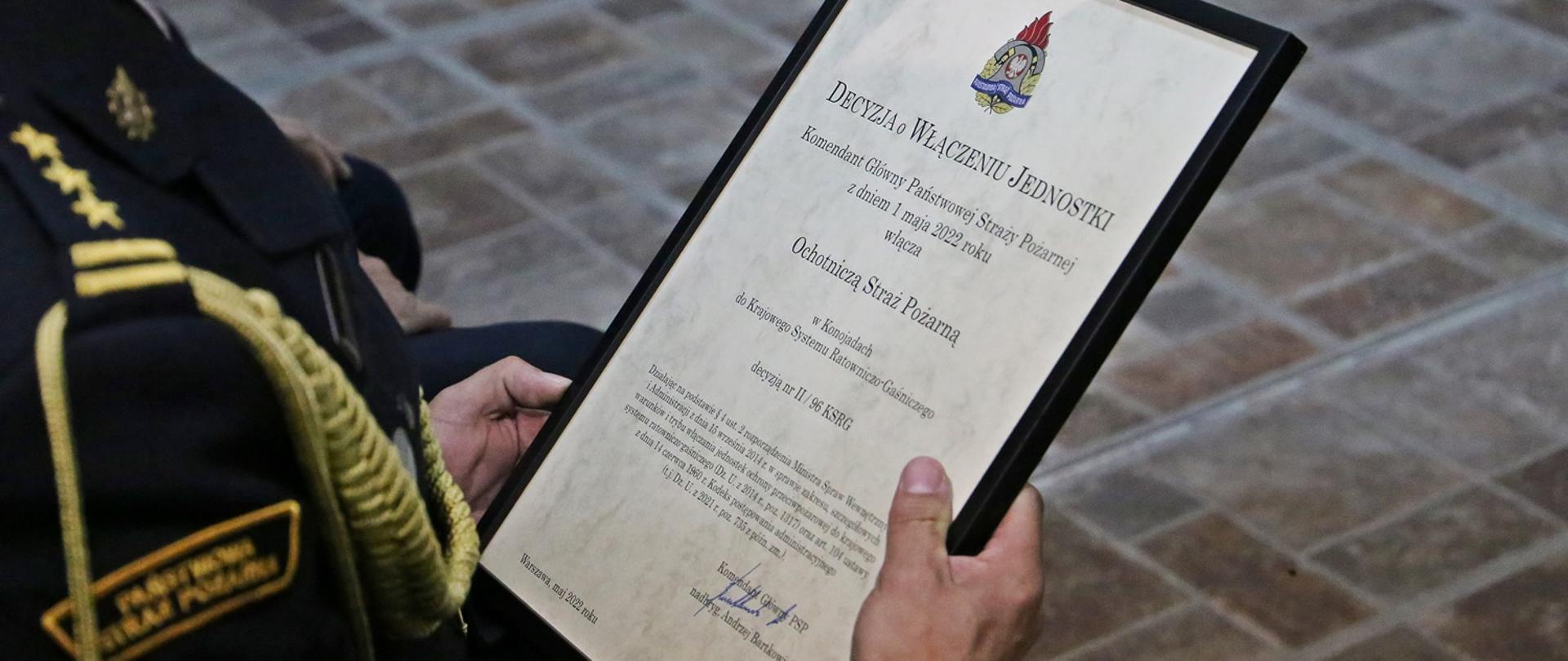 Zdjęcie przedstawia Decyzję Komendanta Głównego PSP o włączeniu Jednostki OSP Konojady do Krajowego Systemu Ratowniczo Gaśniczego.